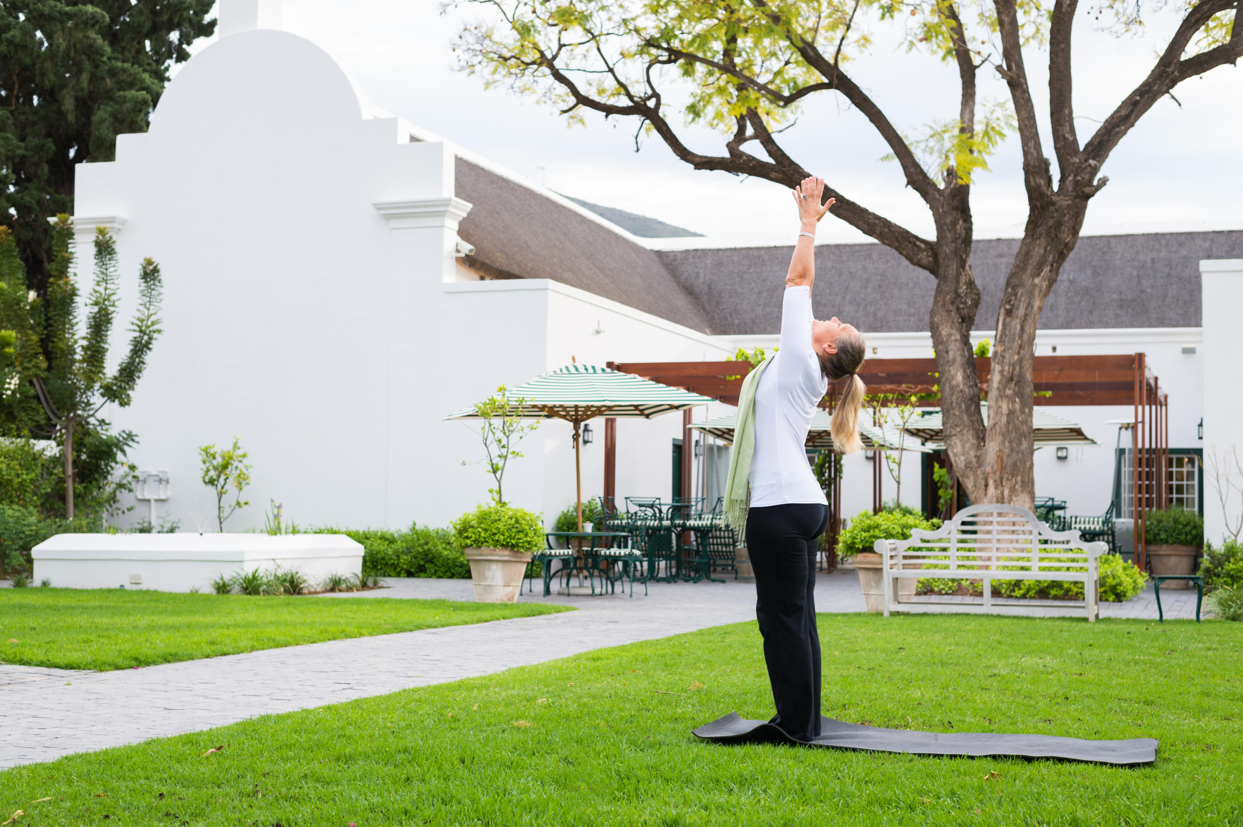 Drostdy Hotel Graaff-Reinet Eksteriør billede A woman practicing yoga at the Cape of Good Hope
